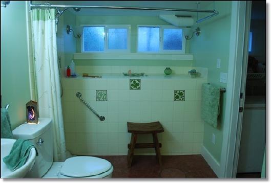CUSTOM BATHROOM SHOWER USING HAND PAINTED BOTANICAL TILES 