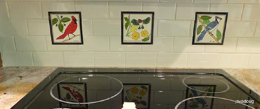 Cardinal Tile,Hummingbird Tile,Bluejay Tile mounted in a stovetop tile backsplash combined with 4"x*' subway tiles 